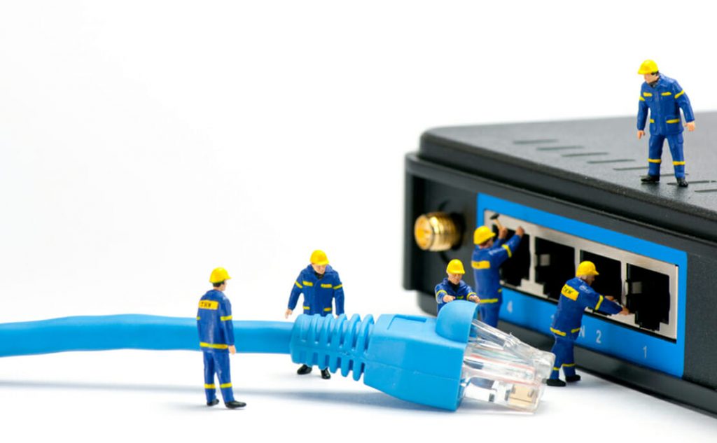 Men Plug Internet Cable in Router